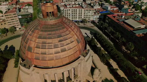 AEREAL-SHOT-OF-Monument-to-the-Revolution,-Tabacalera,-Mexico-capital-city-downtown