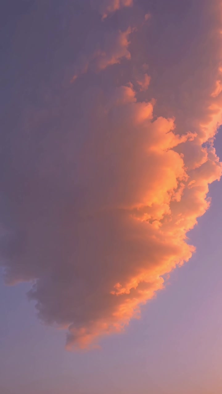 Golden Sunset Clouds Drifting Across a Purple Sky