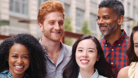 Happy-work-colleagues-standing-outside-their-workplace