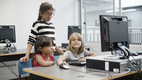 multiethnic girls discussing task on computer science