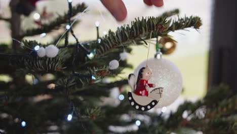 hanging small colorful wooden decoration on christmas tree close up 4k