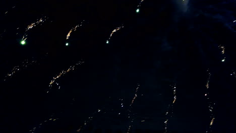 firework display. colorful firework lights streaks in the night sky. happy new year