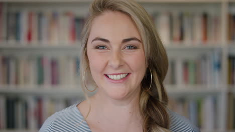 portrait happy young blonde woman student laughing enjoying relaxed lifestyle independent female in library bookstore background