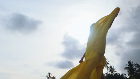 woman in a yellow flowing dress