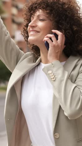 businesswoman using smartphone on city street. vertical