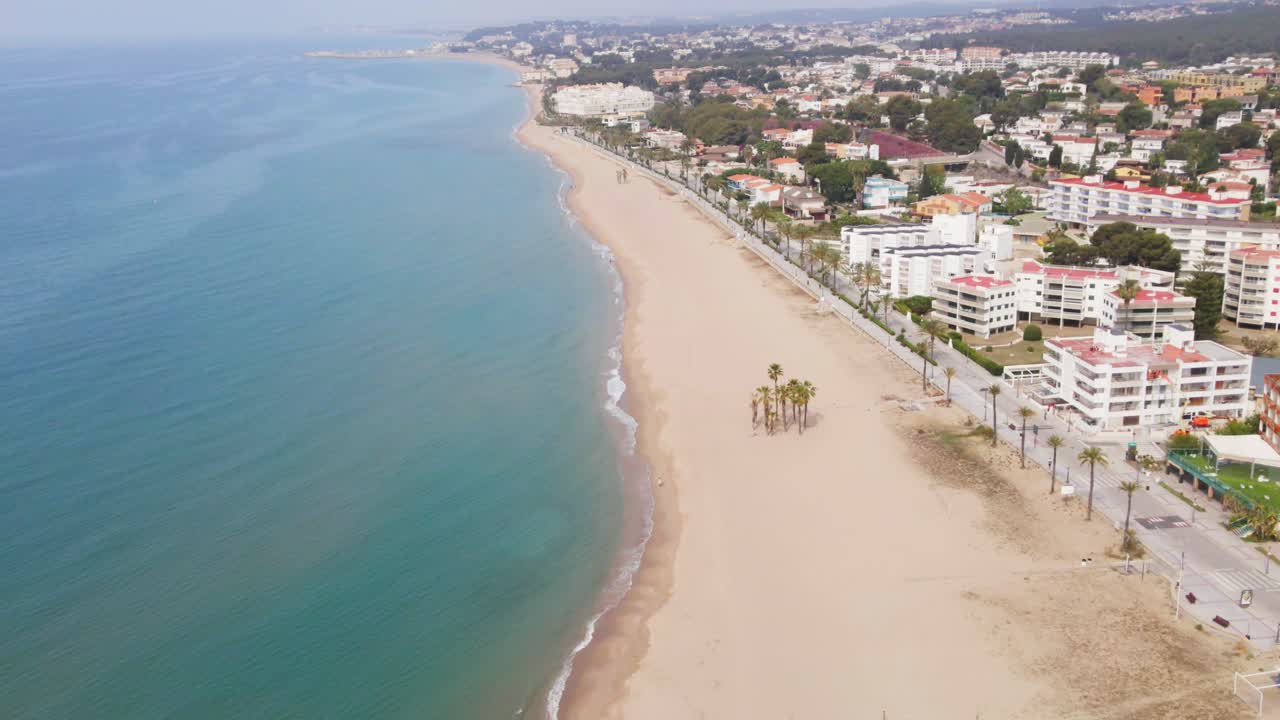 Aerial 4K drone footage of blooming Coma-Ruga in spring, showcasing vibrant trees in different stages of bloom, a picturesque display of nature's rejuvenation