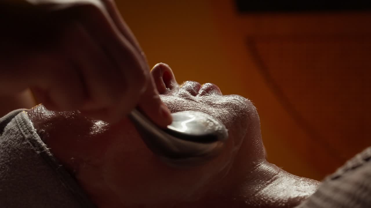 Close-up of Woman Receiving Facial Treatment at a Spa