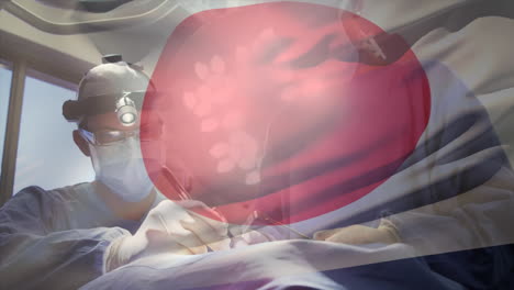 animation of flag of japan waving over surgeons in operating theatre