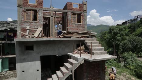 construction work going on in upper himalayas, uttarakhand, india. bridge construction- building construction