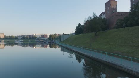 Aerial-Drone-Shot-of-Krakow-Poland-Wawel-Castle-Old-Town-with-the-river-Vistula-at-Sunrise