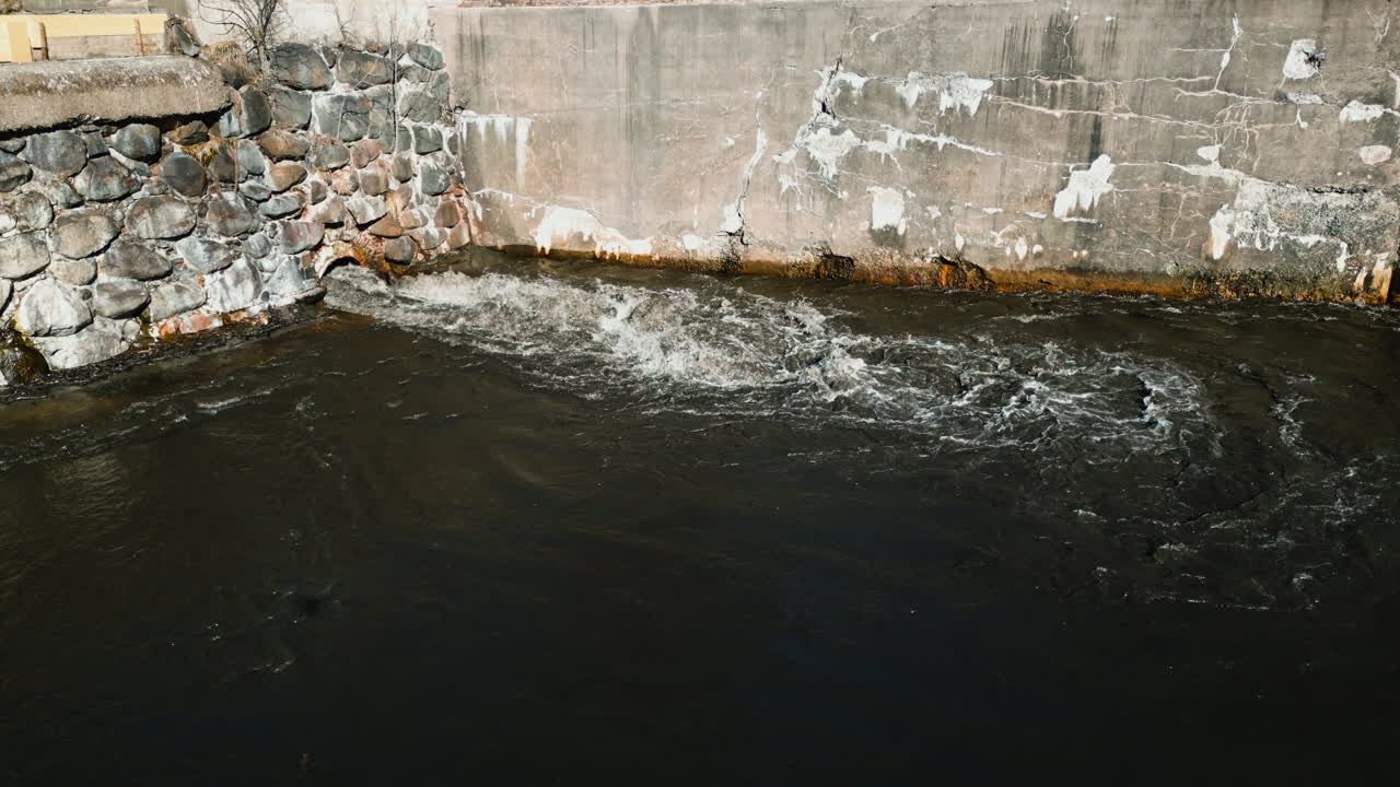 Controlled release of sediment from a tank, water travels through a constructed channel culvert pipe