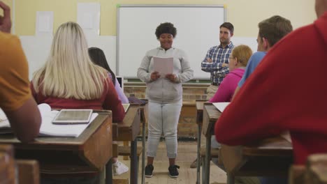 african american high school girl presenting to a group of teenagers