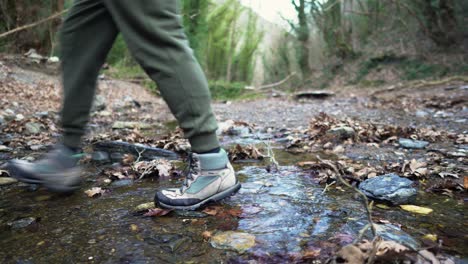 Male-hiker-hiking-crossing-creek-mountain-backpacking-mountain-forest