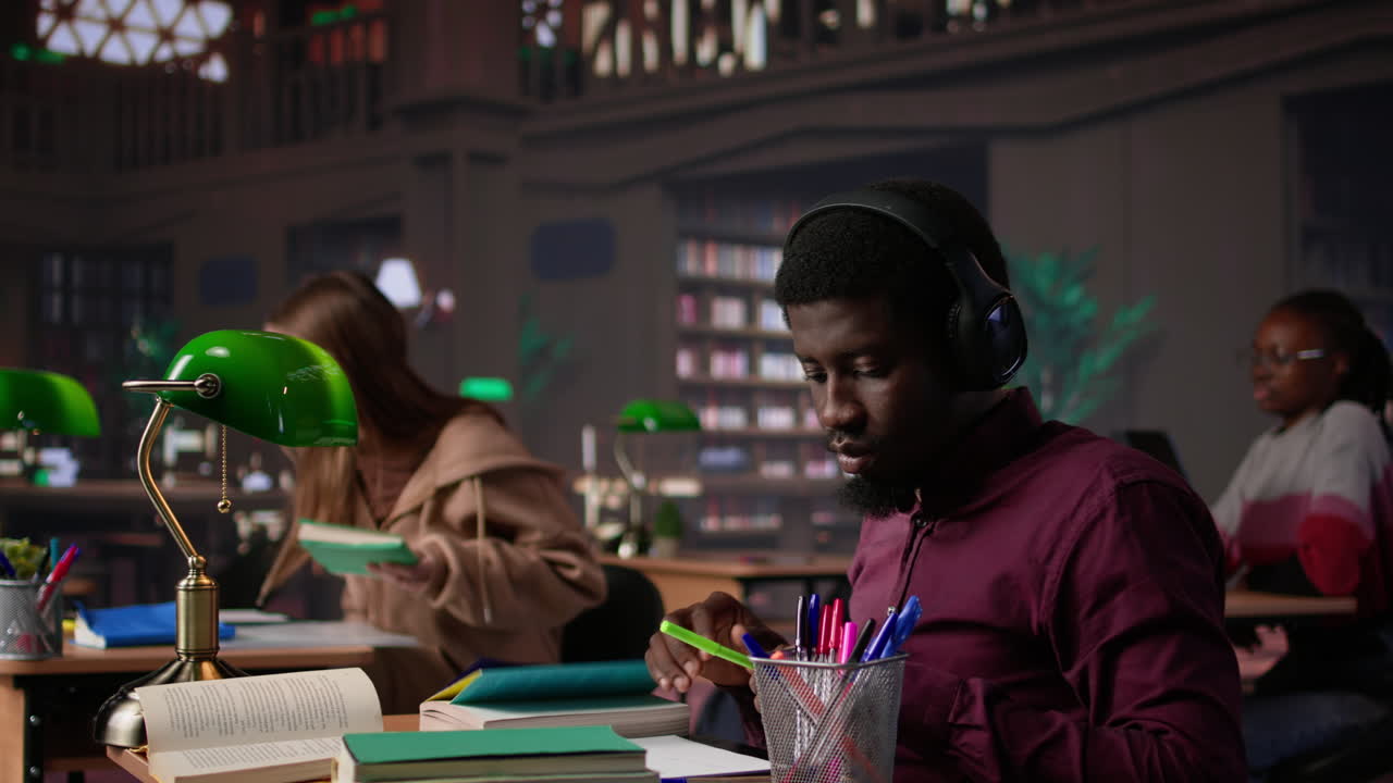 Vertical video black guy using study music to help with deep focus for academic success