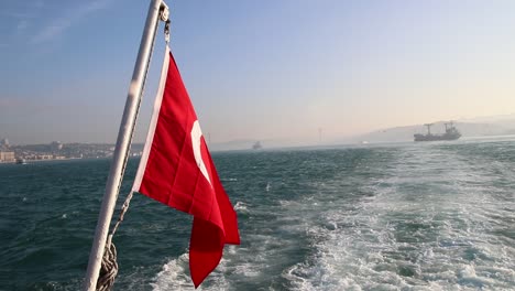 turkish flag waving on the stern of an istanbul