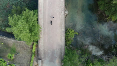 Lago-de-Bolarque,-Young-woman-walking-her-dog-along-foot-paths