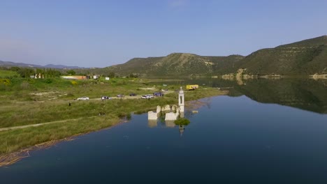 abandoned old church immersed under reservoir water in cyprus