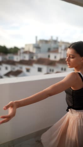 ballet dancer on a rooftop balcony