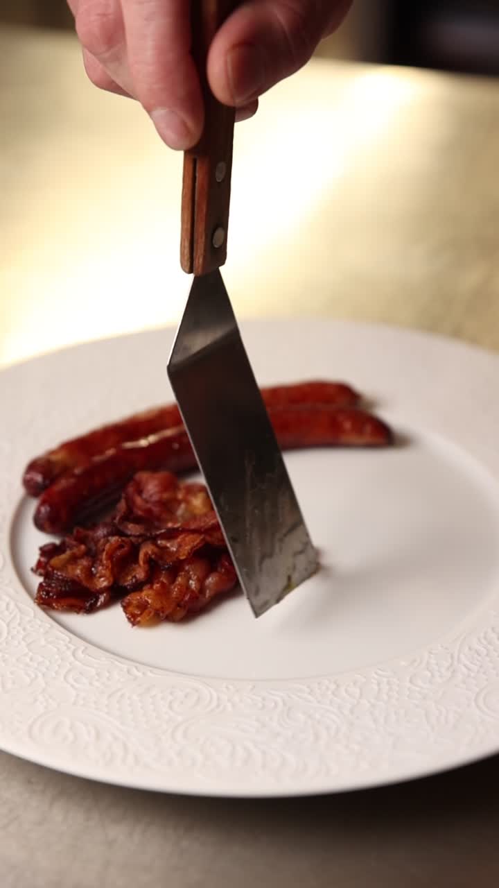 Serving Cooked Sausages and Crispy Bacon on a White Plate