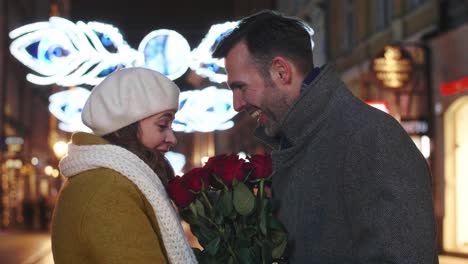 in love man giving a bunch of roses