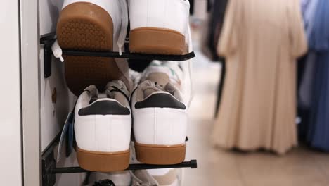 White Sneakers with Gum Soles on Display in Shoe Store