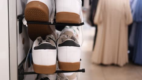 white sneakers with gum soles on display in shoe store