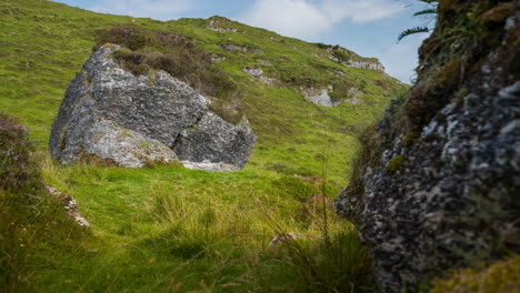 time lapse of rural landscape with grass fields and hills during a cloudy summer day in ireland