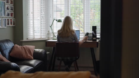 woman working at desk in home office