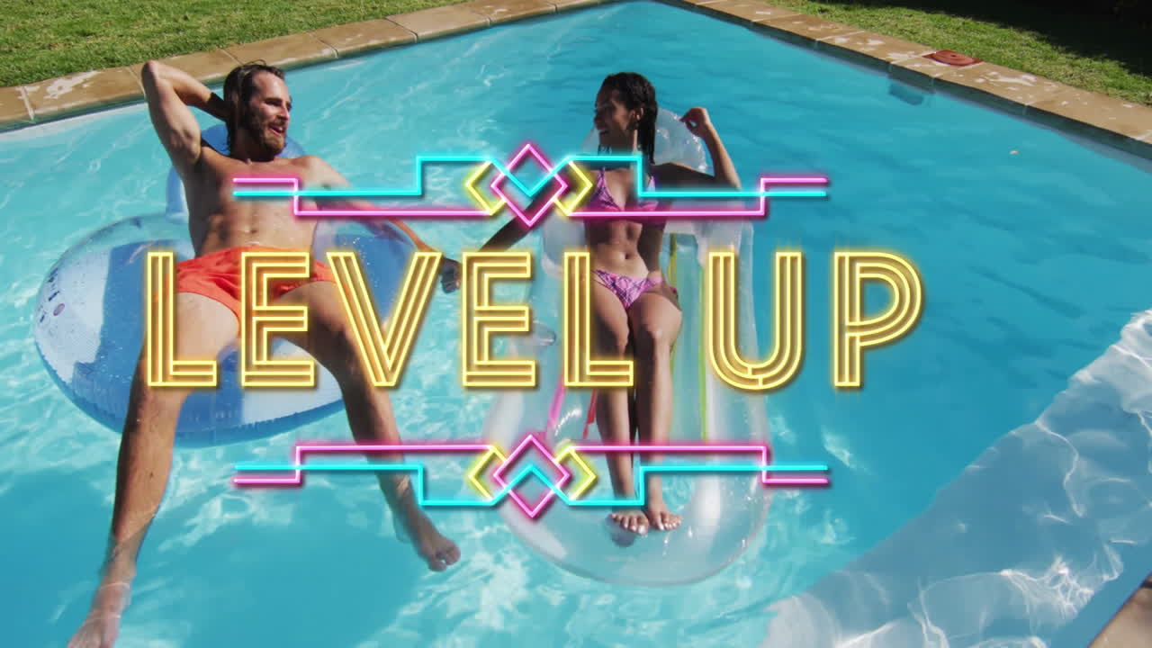Couple relaxing on pool floats with Level Up text animation overlay