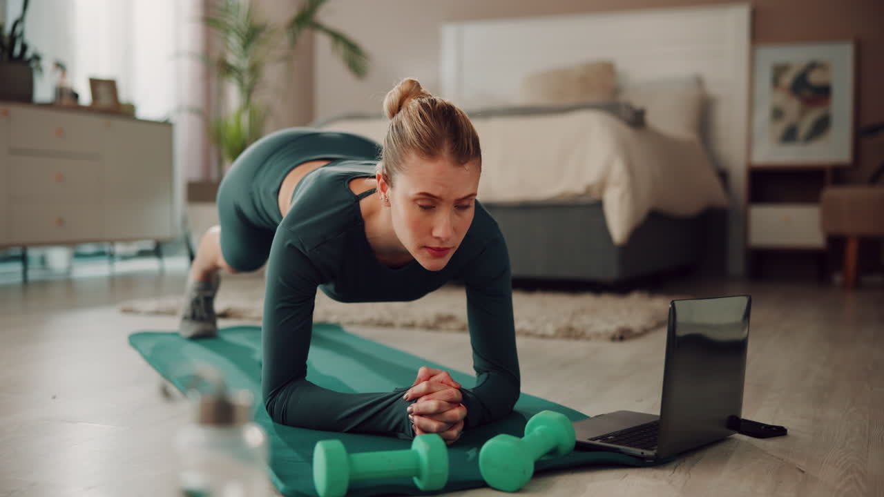 Woman doing plank exercise at home