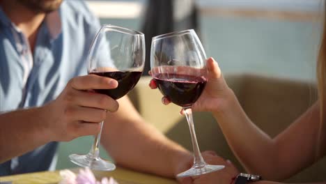couple enjoying red wine outdoors