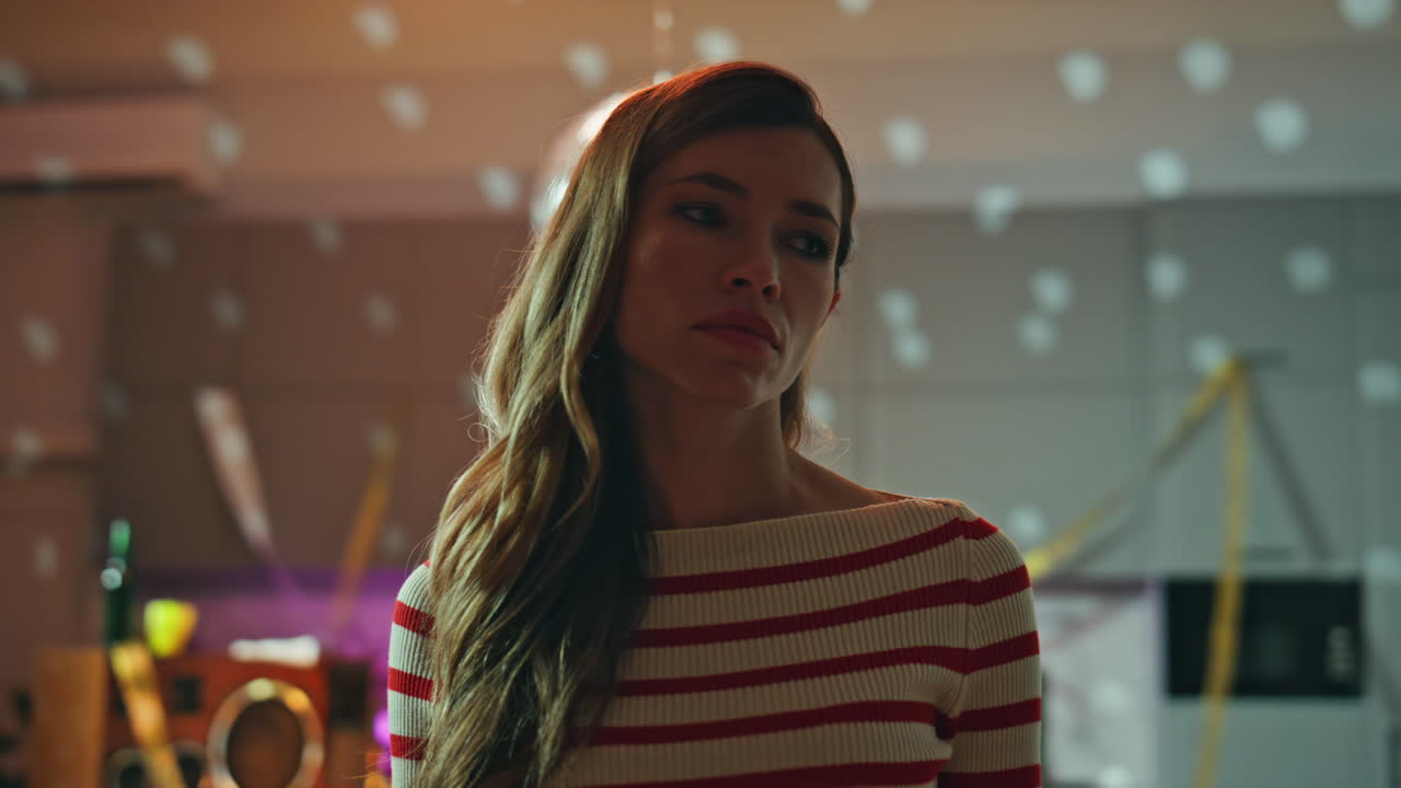 Party girl feeling loneliness staying alone after night gathering close up.