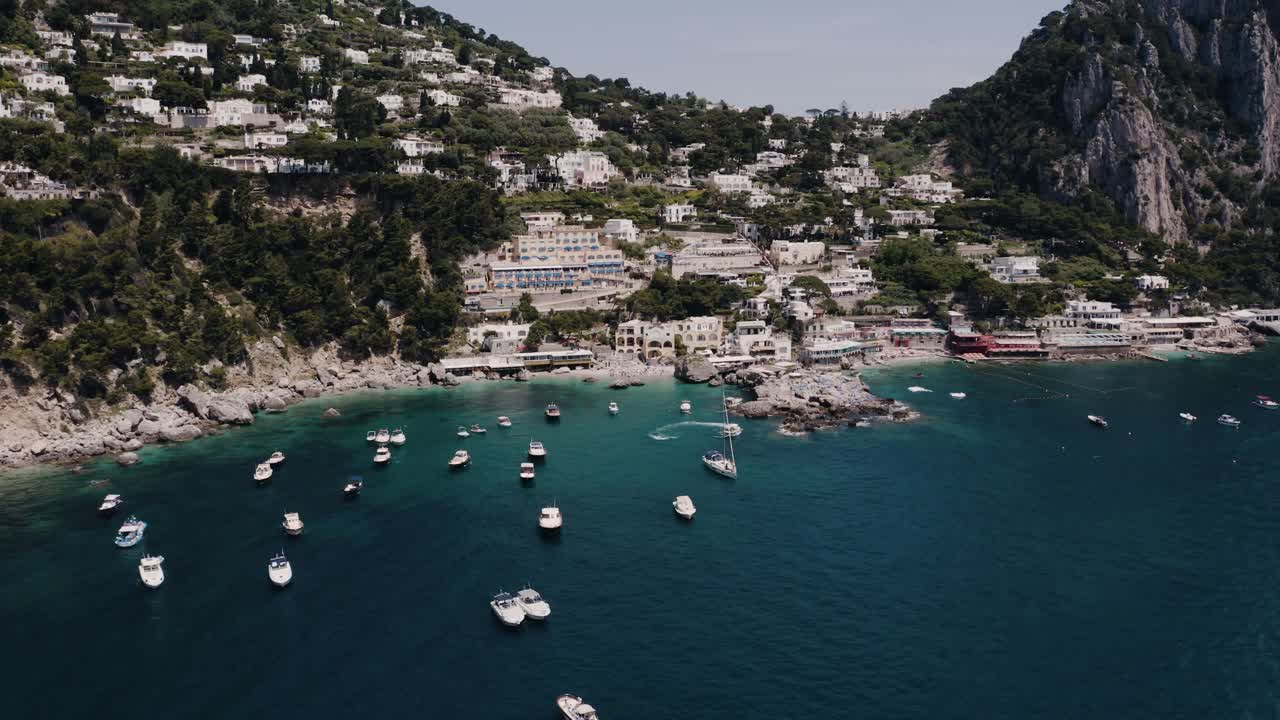 Aerial view of boats lining one of Italy's tourist destinations