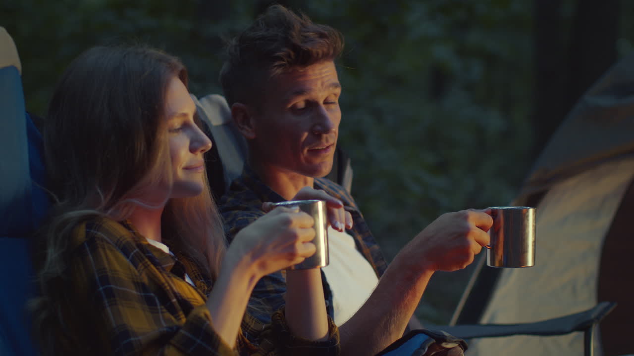 Couple enjoying a campfire