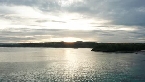 paradise coast of fiji during tropical sunrise with calm ocean surface, aerial