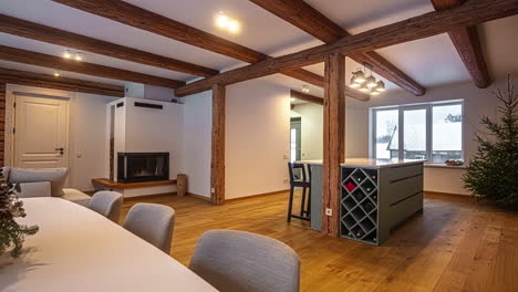 great room in a modern cabin home - panning view of the fireplace, dining room and kitchen