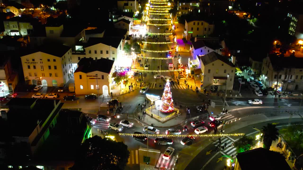 Aerial view of cars and pedestriands at night in Haifa city,  tourist destination