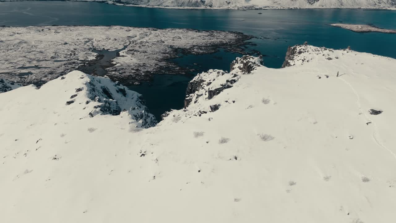 Mountain Peaks Covered With Snow During Winter In Lofoten, Norway. - aerial shot