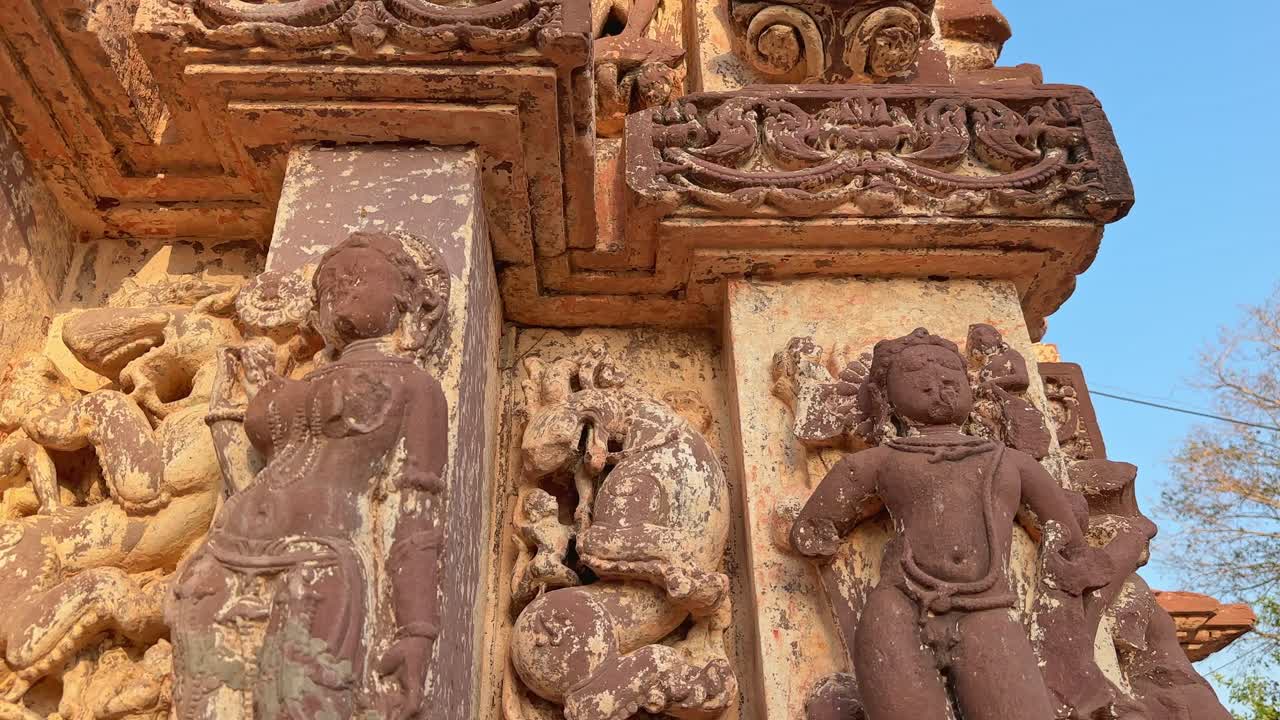 closeup of stone architectural temple with the broken statue and skulptures