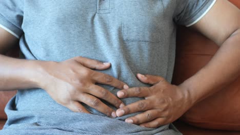 man experiencing abdominal pain