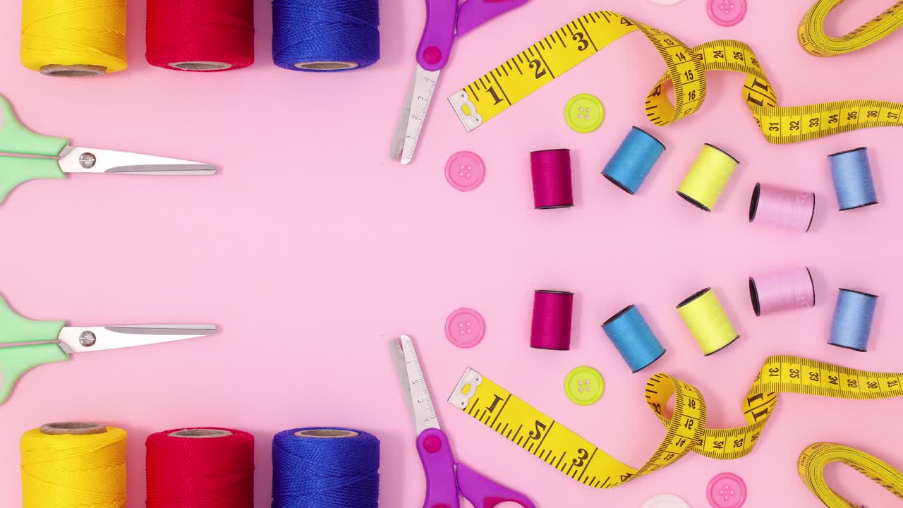 Colorful different sewing and knitting items move on pink theme. Stop motion