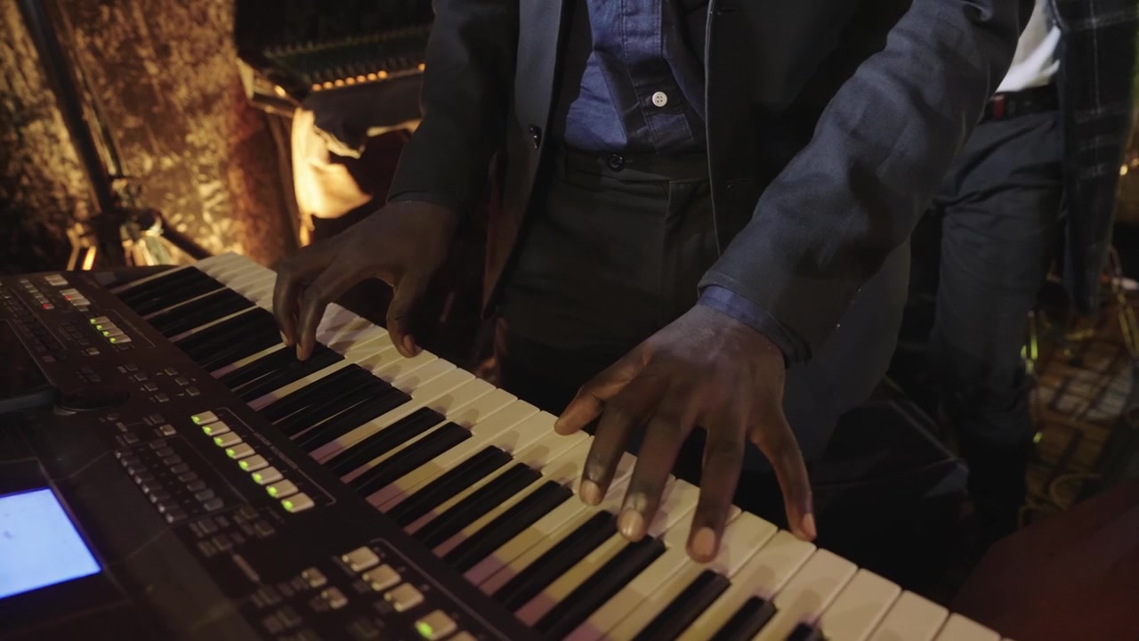 African Man Playing Piano Keyboard 2