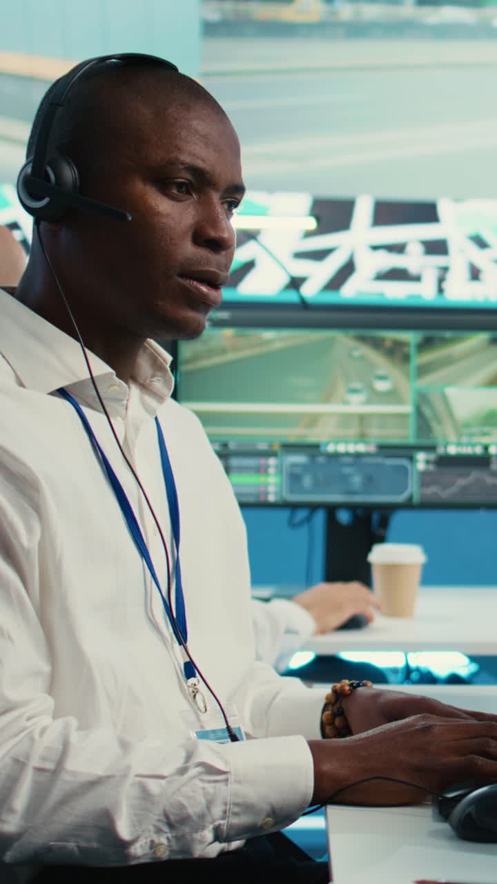 African American Man Working with Headset in Control Room