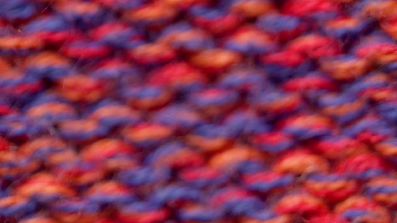 빨간색 뜨개질 스웨터의 질감