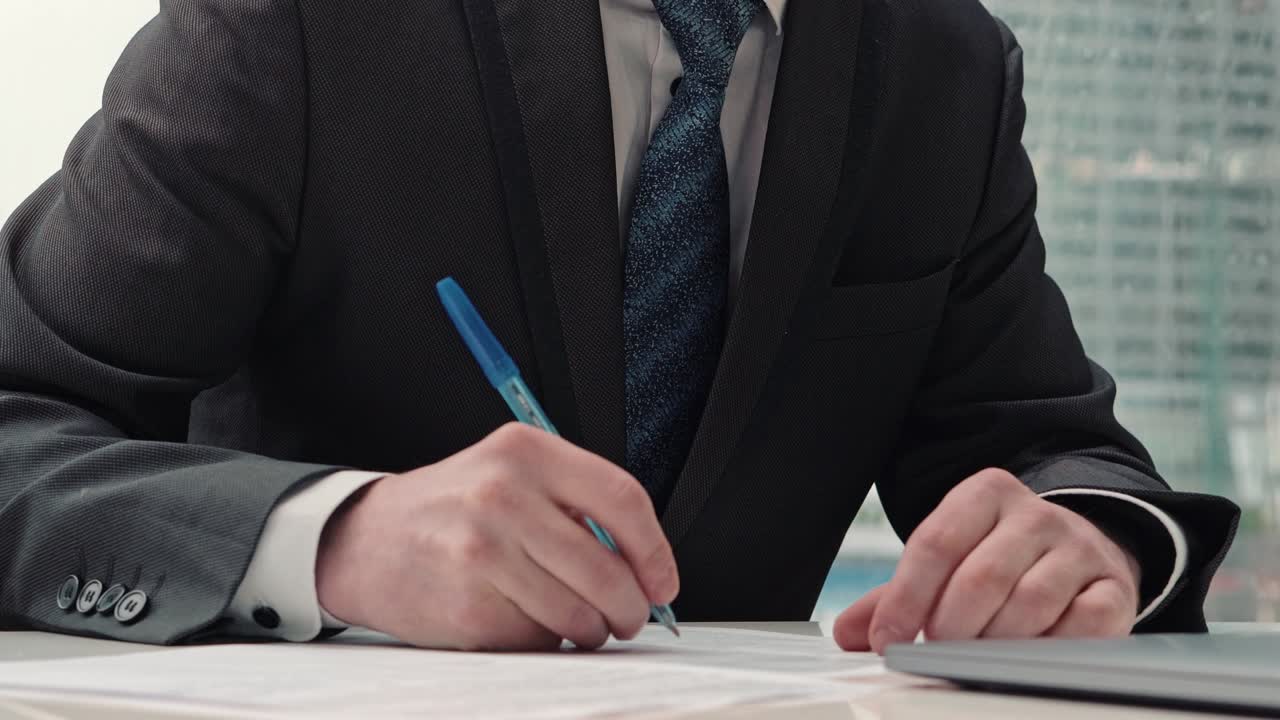 Businessman taking notes or signing contract, pen and document, man in formal jacket. Close up hand