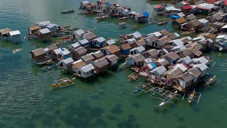 aerial footage of a make shift village in the ocean