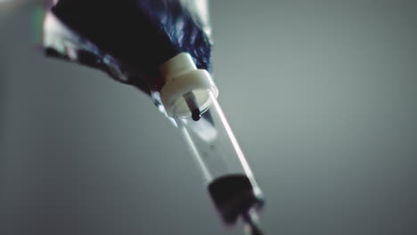 dark liquid is dripping slowly