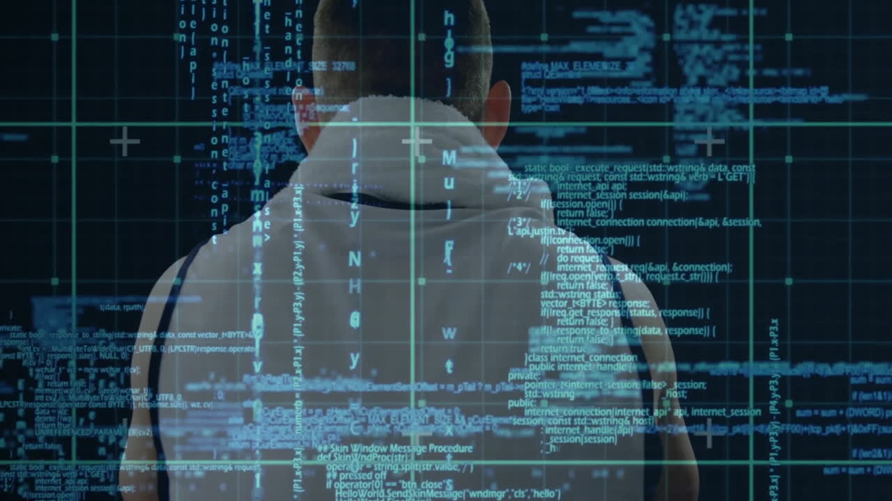 Facing digital code and data projections, person in hoodie using animation software