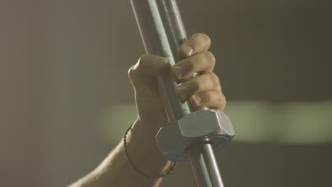 person holding a barbell