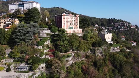 iconic buildings of brunate town in italy, aerial drone view